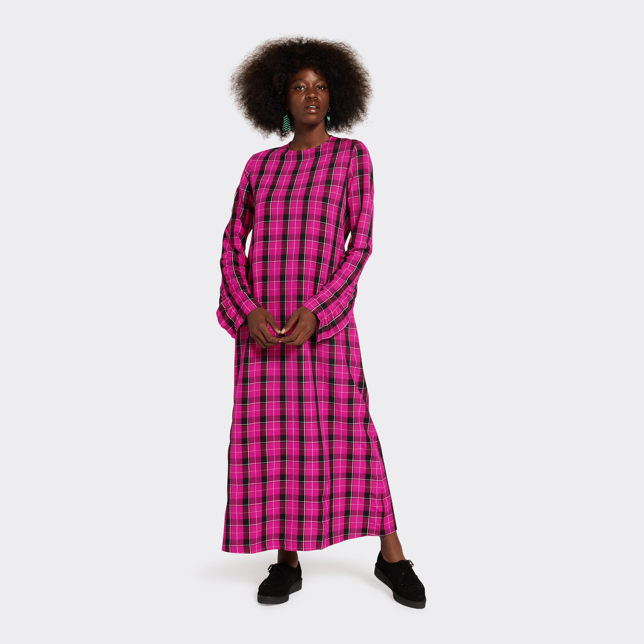 Long pink dress in Maasai fabric with black checks on model