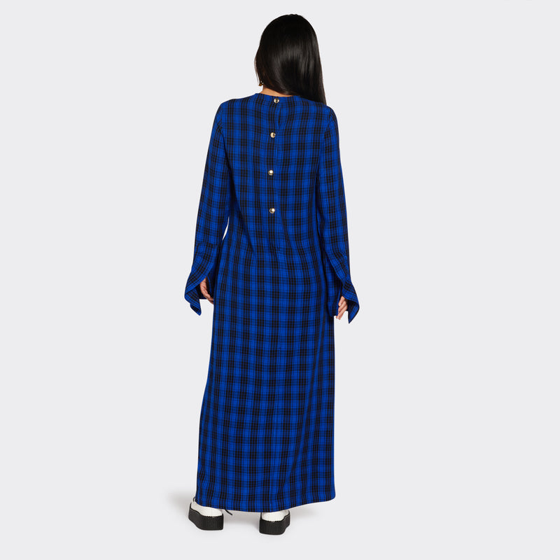 Long blue dress in Maasai fabric with black checks on model seen from the back