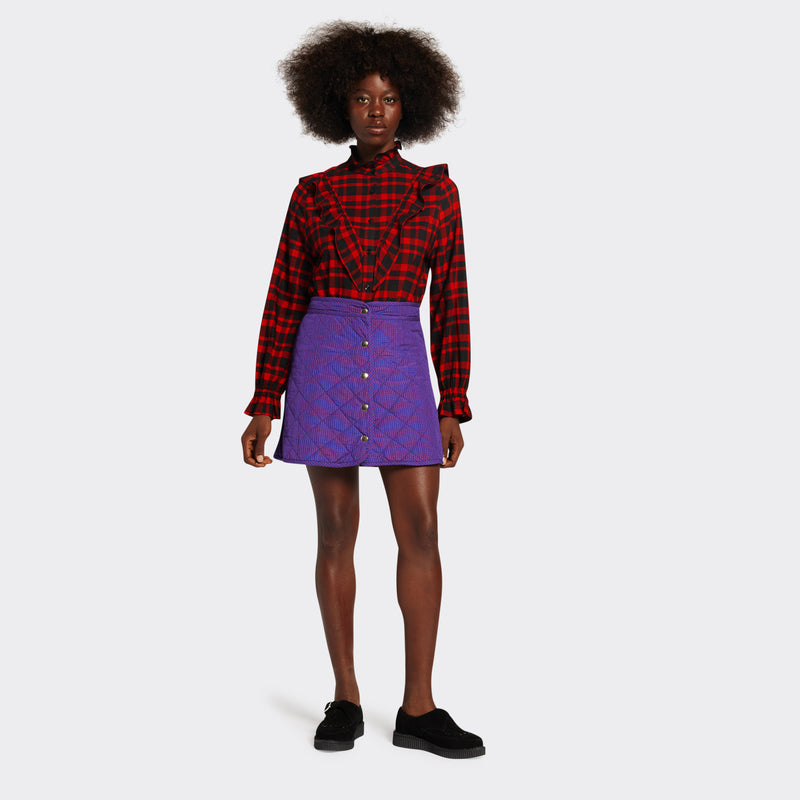 reversible padded miniskirt in maasai fabric worn on the purple side with mini checks