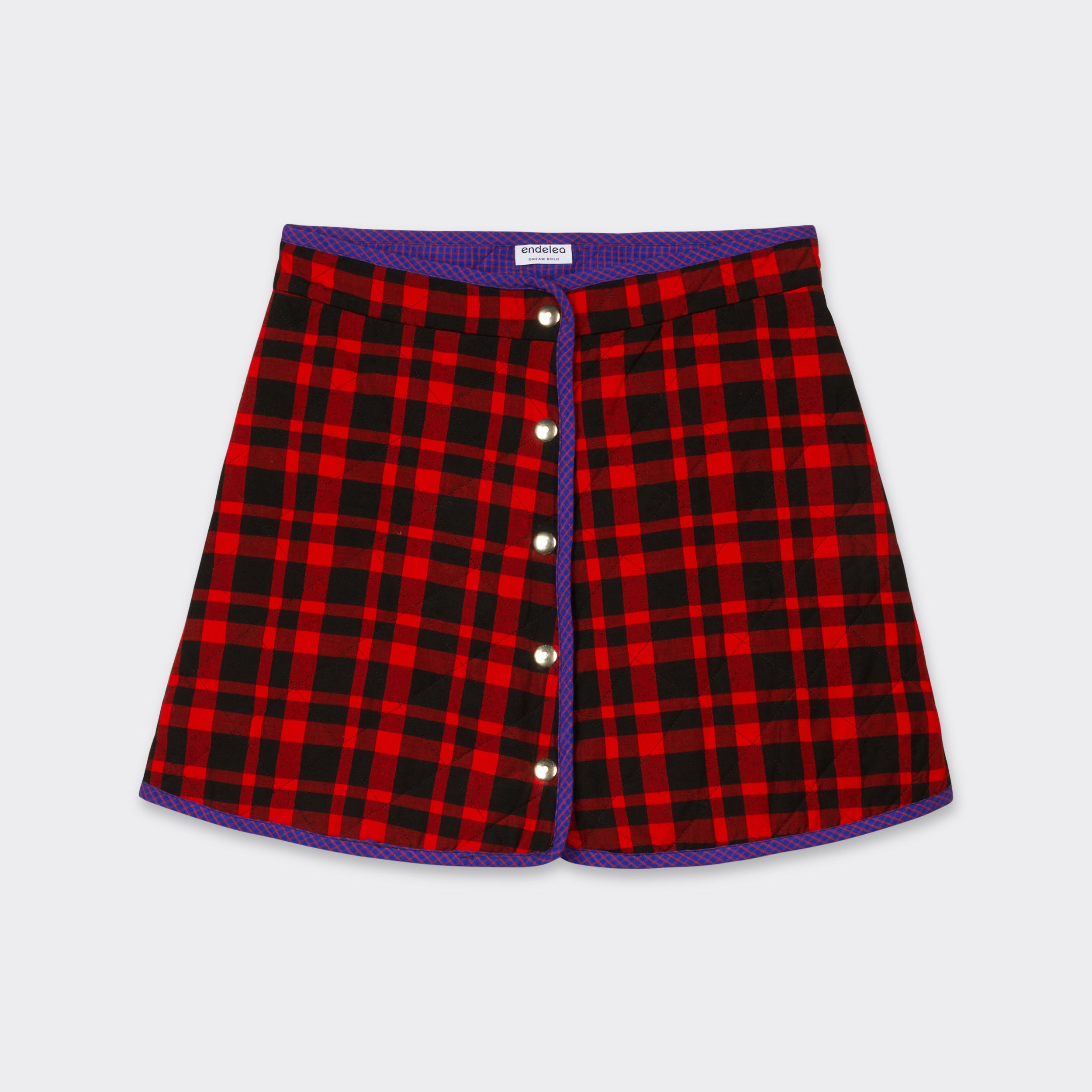 reversible padded miniskirt in maasai fabric on the black side with red checks