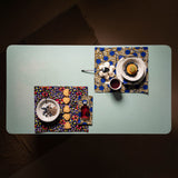 Place mats in wax fabric, one with multicolor geometric print and the other with blue dots,with matching napkins