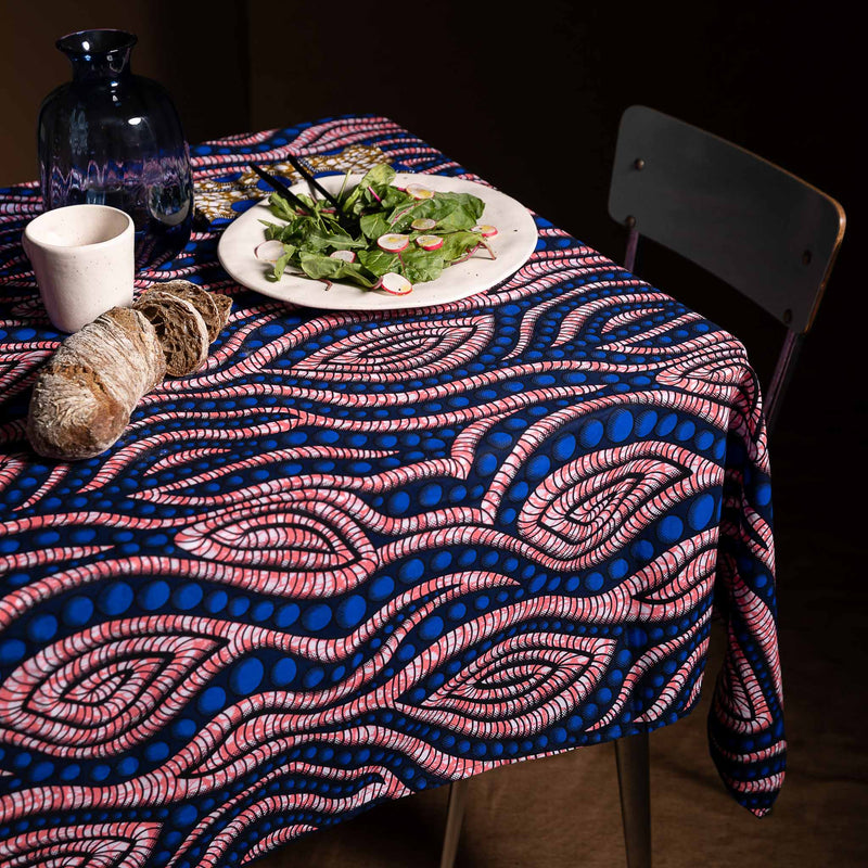 Tablecloth in african wax fabric with blue dots and pink spirals