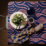 Tablecloth in african wax fabric with blue dots and pink spirals with matching napkins