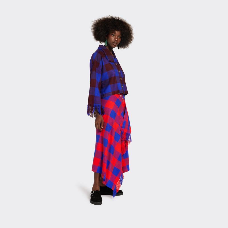 Red&Blue skirt with fringes in Maasai Shuka fabric with golden snap buttons on model 