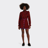 reversible padded miniskirt in maasai fabric worn on the black side with red checks