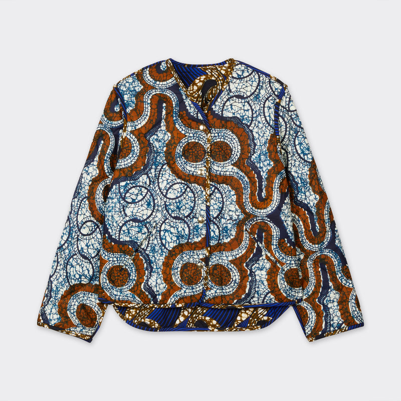 Reversible down jacket in African wax fabric with blue and brown 'marble' pattern 