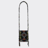 Still life: Crossbody Mini Bag in Wax Almasi Game with the colors black and red..