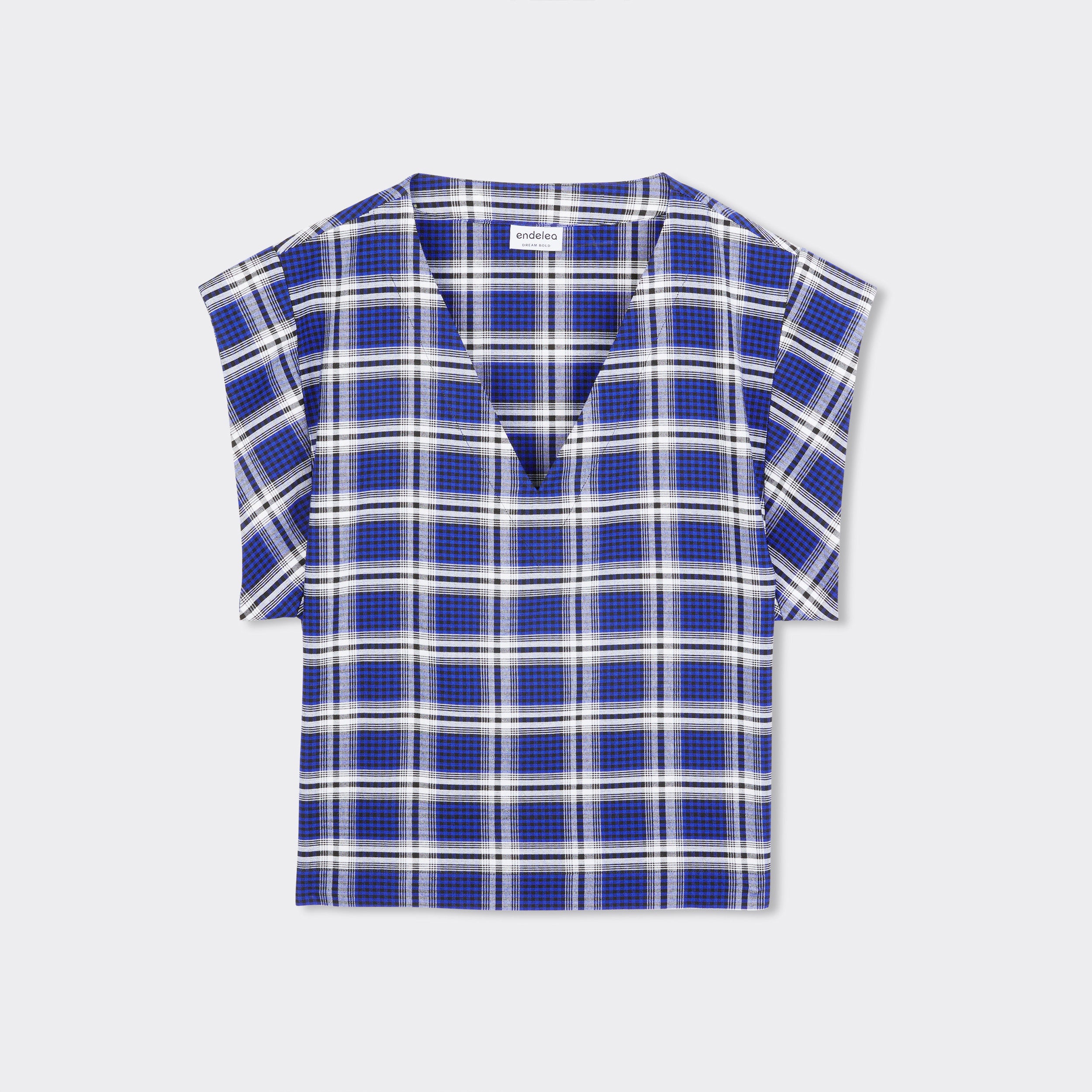 Still life:  V-Neck top with short sleeves. The print is Maasai Check in blue and white.