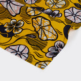Still life: Pair of Napkins in Wax Yellow Dance with colors yellow and black.