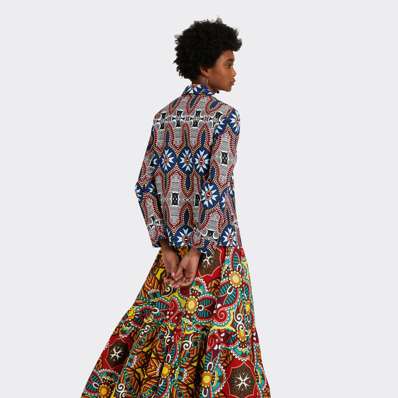 Model wears the Shirt in Wax Summer Soundtrack in the colors blue and pink, along with the Flounced Maxi Skirt in Wax African Dream with the colors yellow, blue and red. 