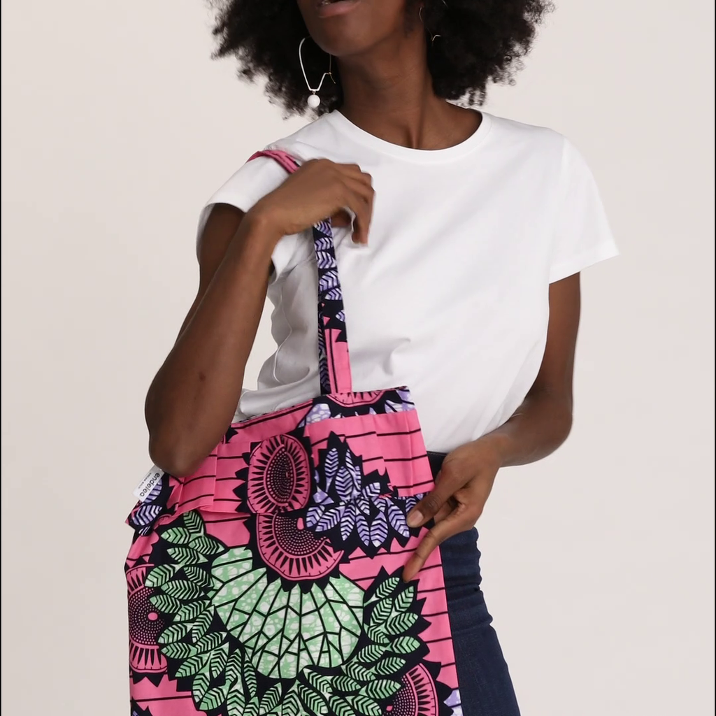 Video: Model holds all different color variants of the Tote Bag with Rouche in Wax, including African Dream, Dreamcatcher, Candy Leaves, Sun Labyrinth, and Almasi Game.
