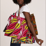 Video: Models wear Crossbody Mini Bags in Wax in all color variants; African Dream, Iris Fantasy, Almasi Game, and Magic Mosaic.