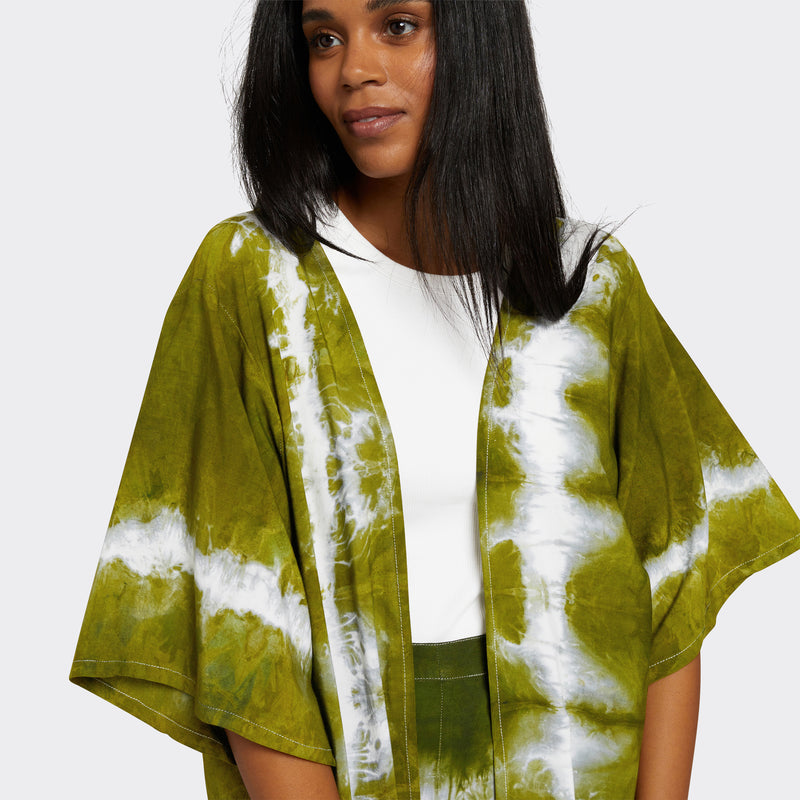 Model wears a Kimono in Tie Dye Intense Green with a white shirt underneath. Along with the Wrap Trousers in Tie Dye Intense Green.