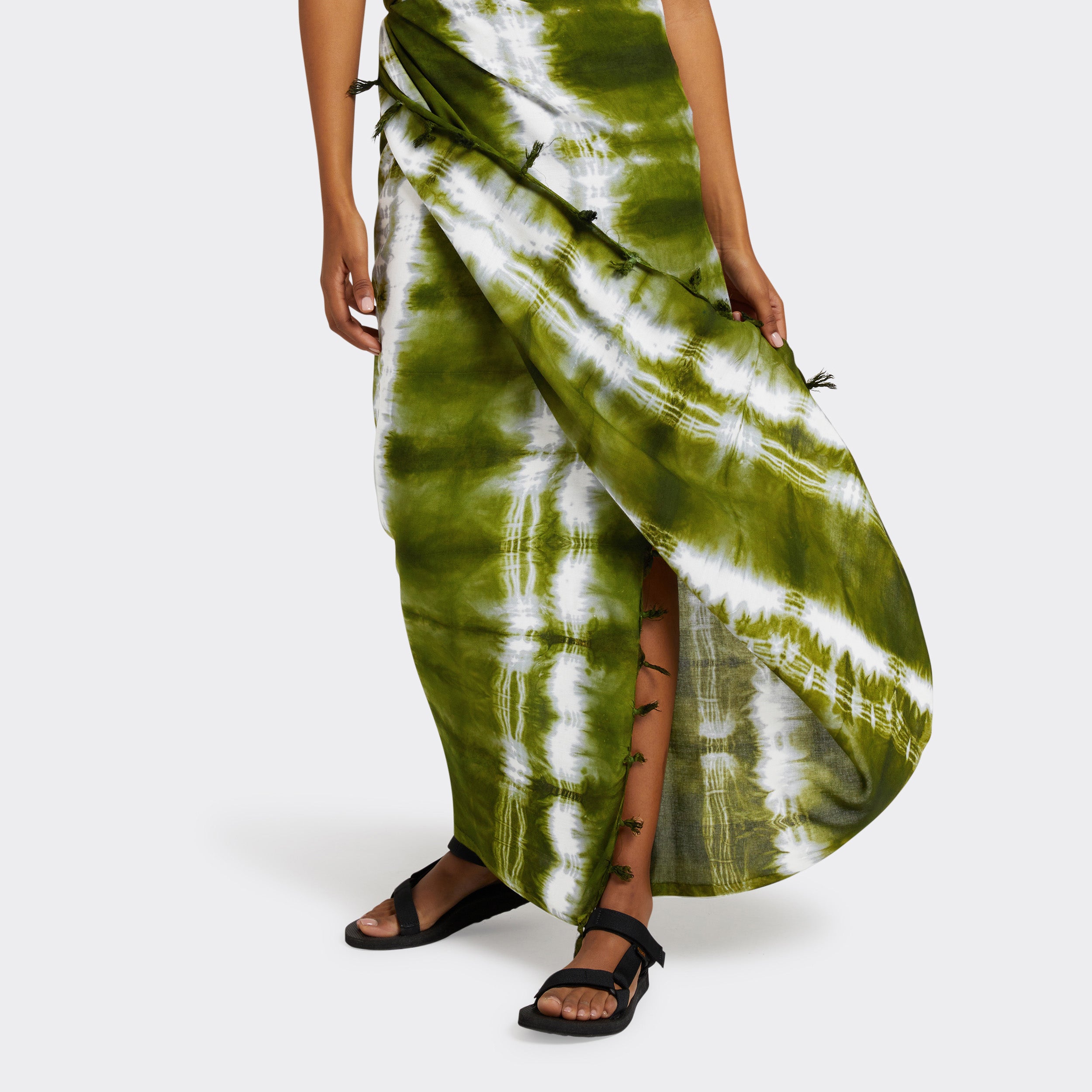 Model wears a Pareo in Tie Dye Intense Green as a skirt.