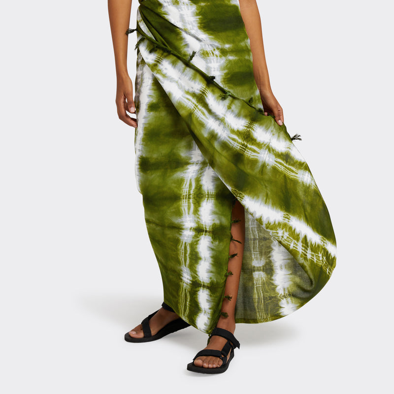 Model wears a Pareo in Tie Dye Intense Green as a skirt.