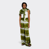 Model wears a Pareo in Tie Dye Intense Green as a shawl with a white shirt underneath. Along with the Wrap Trousers in Tie Dye Intense Green.