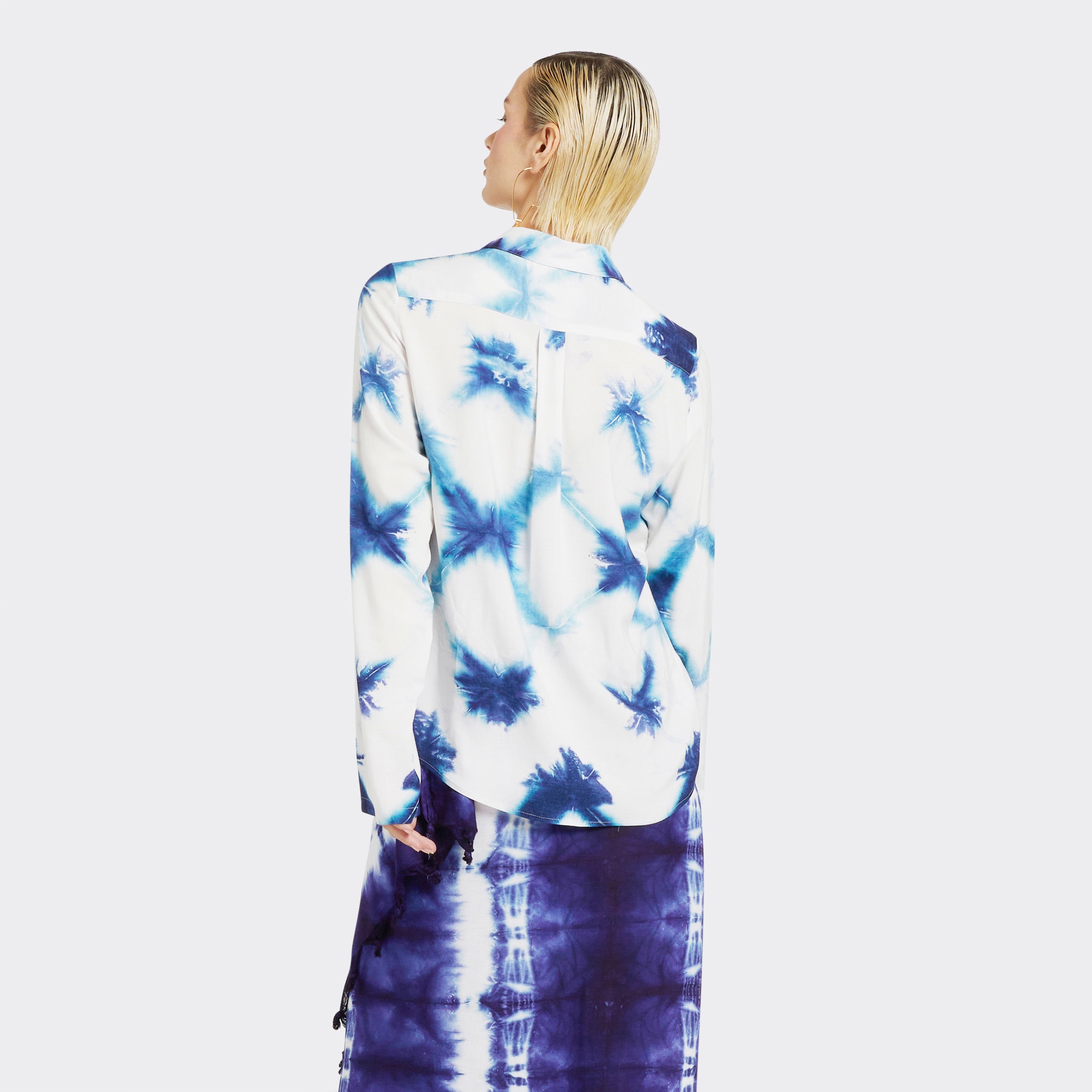 Model wears Shirt in Tie Dye White and Blue with a Pareo in Tie Dye Soft Blue.
