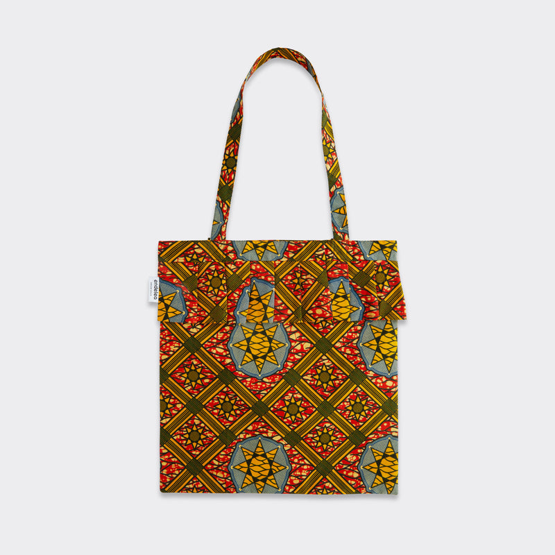 Still life: Tote Bag with Rouche in Wax Sun Labyrinth with colors yellow, red and blue.