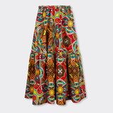 Still life: Flounced Maxi Skirt in Wax African Dream with the colors yellow, blue and red.