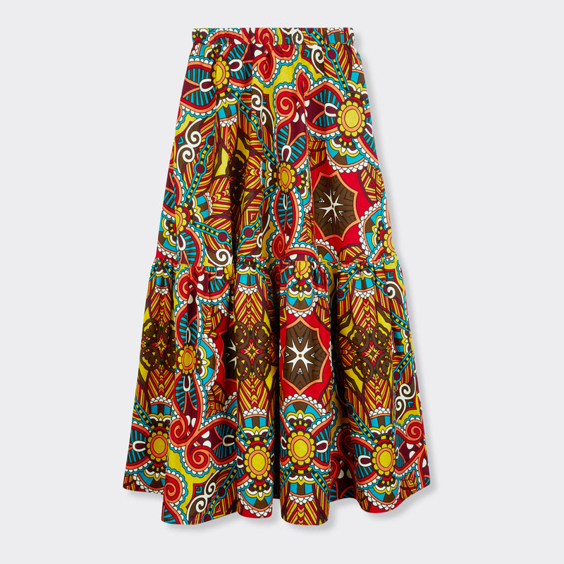 Still life: Flounced Maxi Skirt in Wax African Dream with the colors yellow, blue and red.